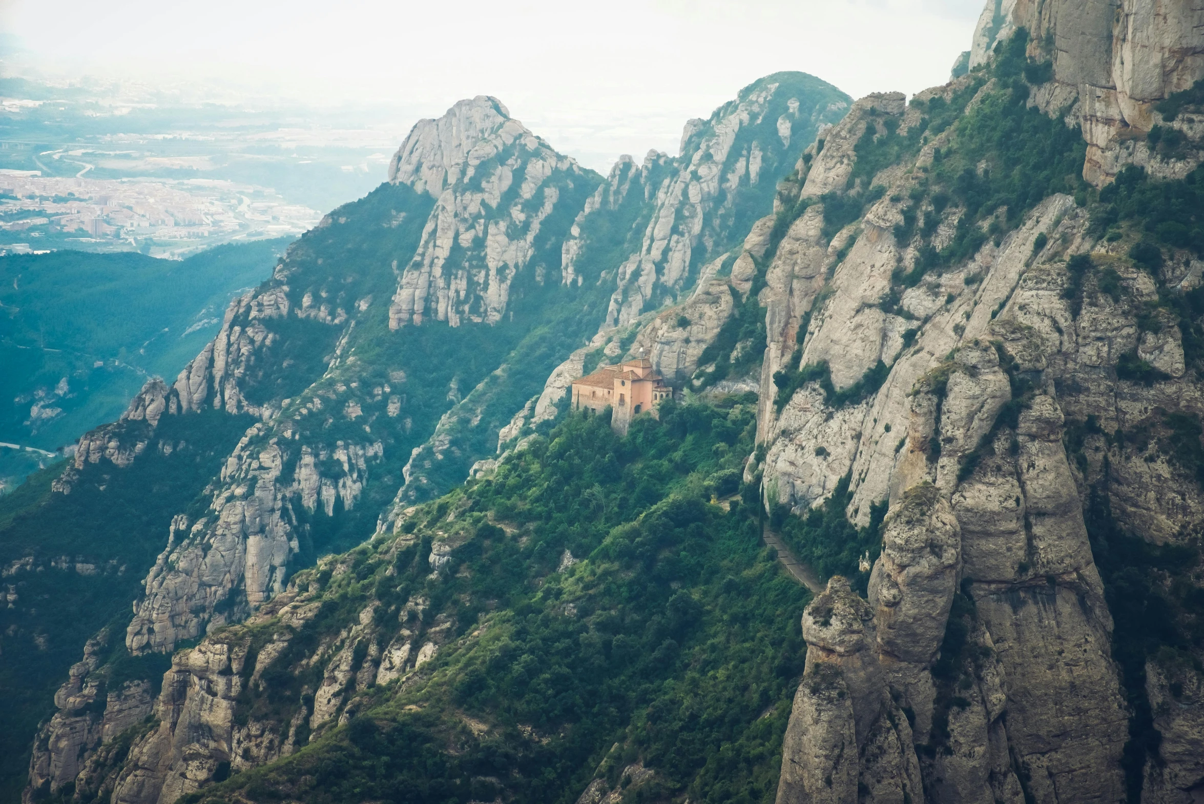 a castle perched on the side of a mountain, pexels contest winner, baroque, monserrat gudiol, “ aerial view of a mountain, byzantine, iu