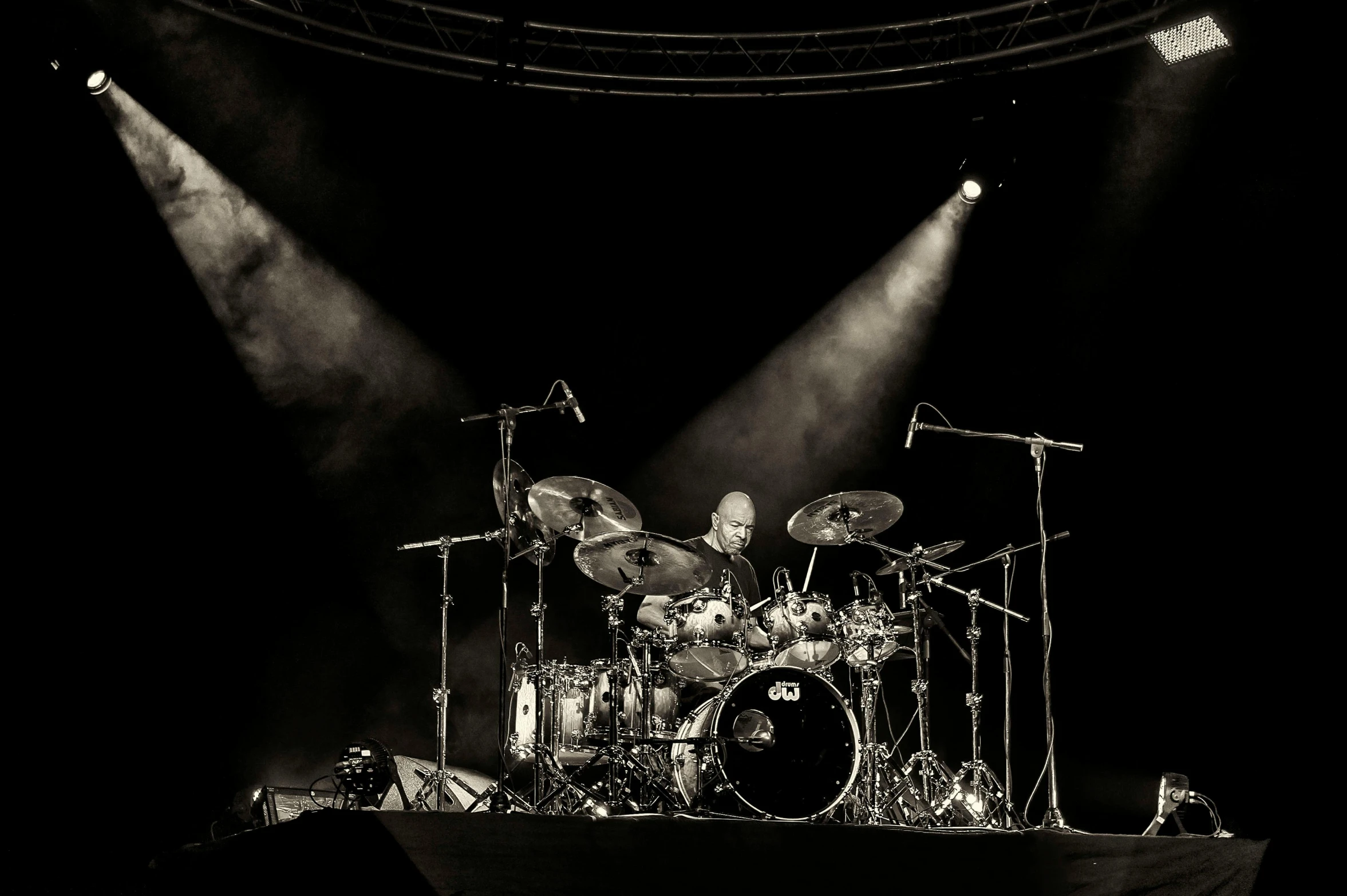 a black and white photo of a drum set, a portrait, by Steve Prescott, pexels contest winner, performing on stage, paul barson, ilustration, portrait image