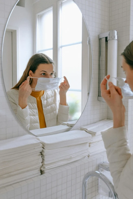 a woman brushing her teeth in front of a mirror, pexels contest winner, happening, masked doctors, made of lab tissue, grey, multi - layer