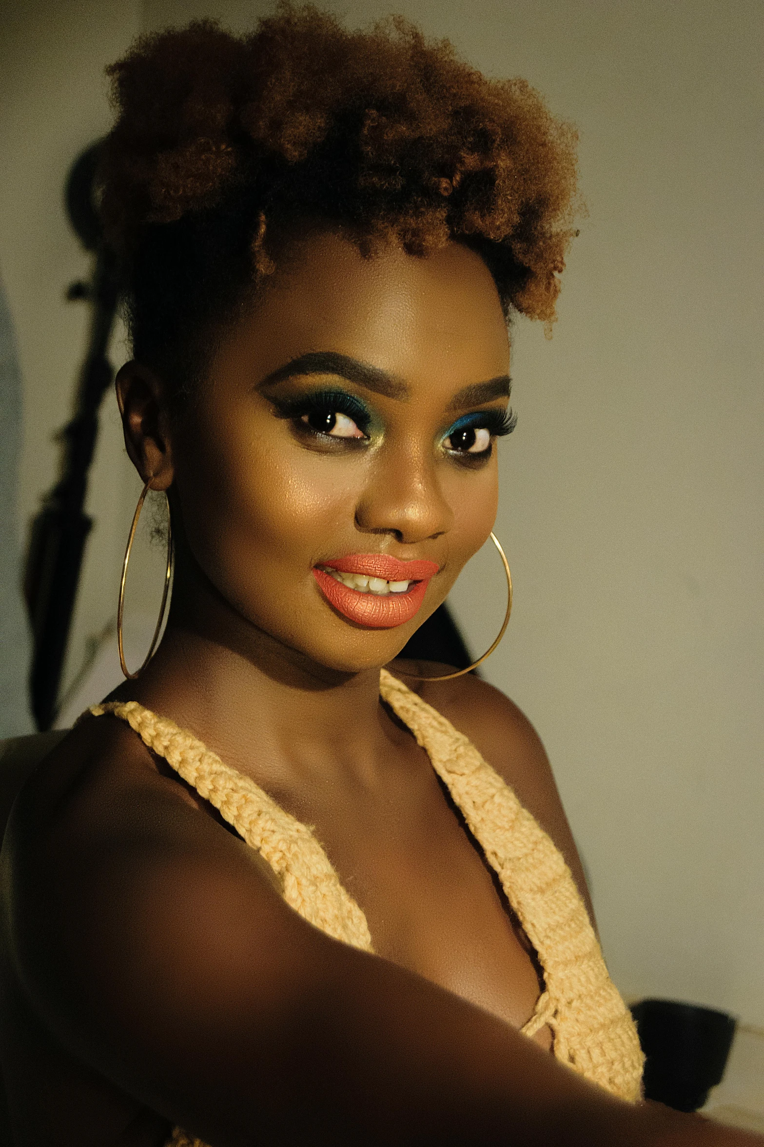 a woman sitting in front of a laptop computer, an album cover, inspired by Chinwe Chukwuogo-Roy, portrait of a hyena girl, stunning closeupheadshot, loosely cropped, glamorous runway model