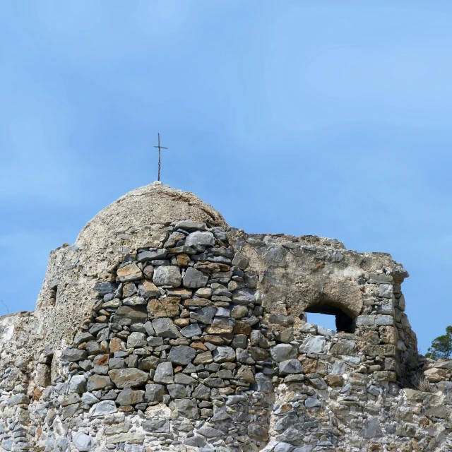 a stone building with a cross on top of it, pathos, fan favorite, panoramic