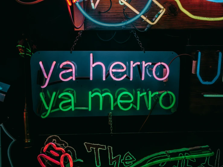 a neon sign that says ya hero ya merro, by Gina Pellón, trending on unsplash, latino, a 1980s goth nightclub in soho, zoomed in, puerto rican super hero