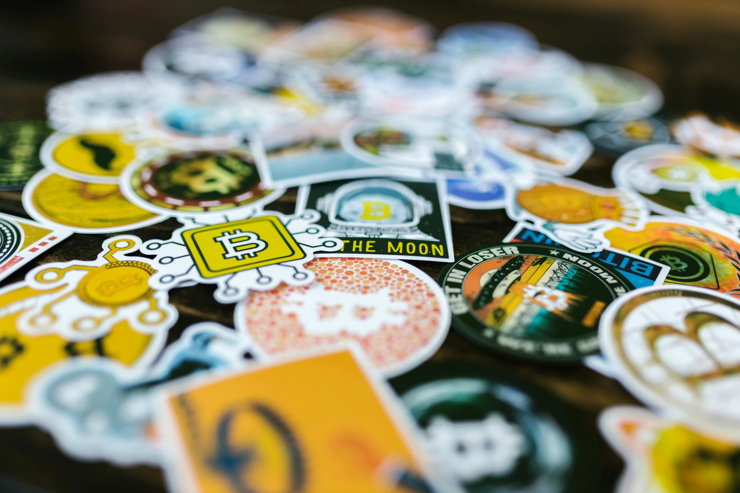 a pile of stickers sitting on top of a table, unsplash, pixel art, bitcoin, 9 9 designs, up close picture, beer