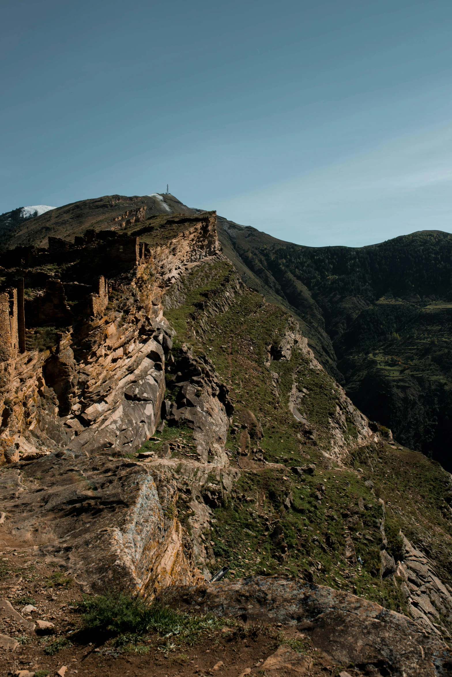 a group of people standing on top of a mountain, les nabis, buildings carved out of stone, slide show, gigapixel photo