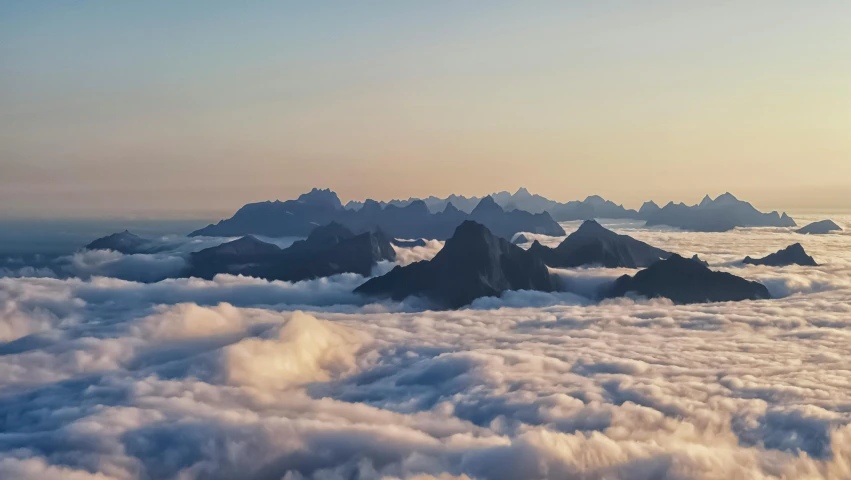 a view of a mountain range from above the clouds, an album cover, pexels contest winner, new zeeland, 4 k cinematic panoramic view, predawn, today\'s featured photograph 4k