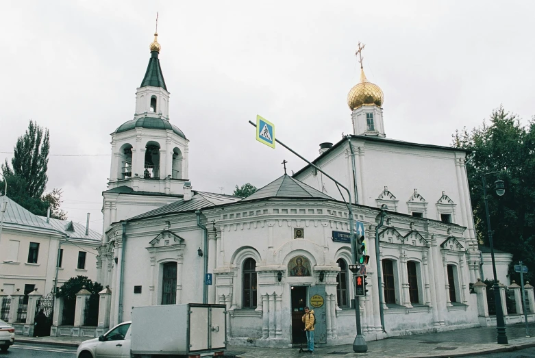 a large white building with a golden dome, inspired by Nikolai Alekseyevich Kasatkin, 🚿🗝📝, in a church. arstation, streetscape, grey