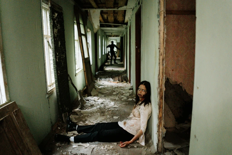a woman laying on the floor of a run down building, pexels contest winner, shin hanga, slenderman zombie, standing in corner of room, andrey tarkovsky, taken in the late 2010s