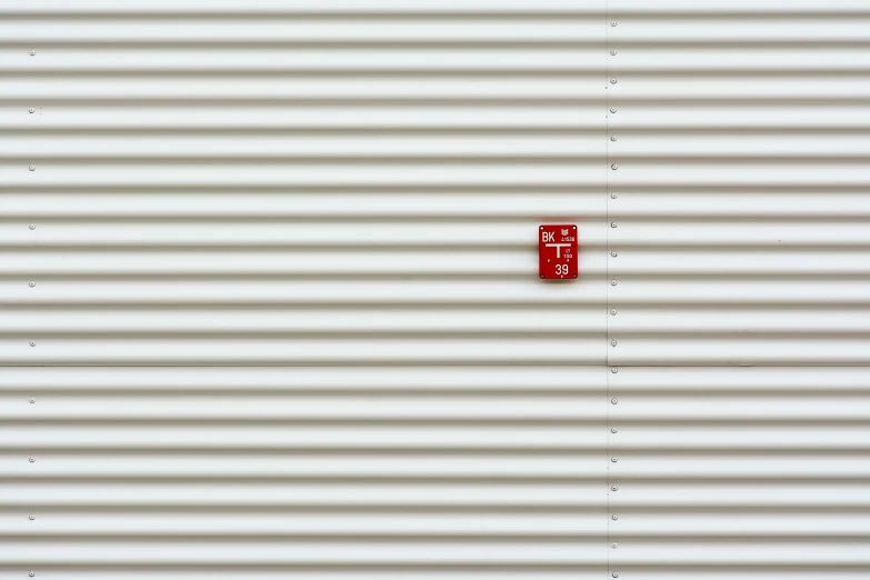 a red fire hydrant sitting on the side of a building, inspired by Andreas Gursky, postminimalism, white steel, shed, f / 1. 9 6. 8 1 mm iso 4 0, panel