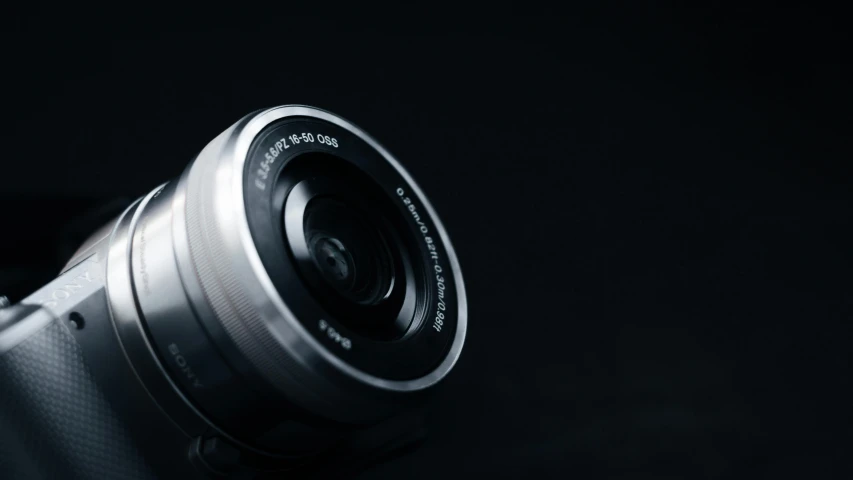 a close up of a camera lens on a table, by Adam Marczyński, pexels contest winner, photorealism, sigma 1 0 - 2 0 mm, panoramic anamorphic, high angle close up shot, smooth.sharp focus