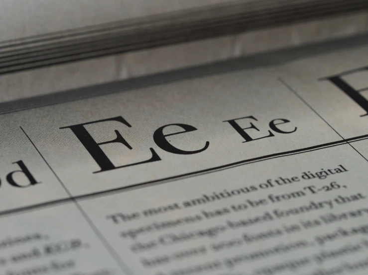 a close up of a newspaper on a table, an illustration of, pexels, letterism, eeyrie, perfect fces, with laser-like focus, aaaaaaaaaaaaaaaaaaaaaa