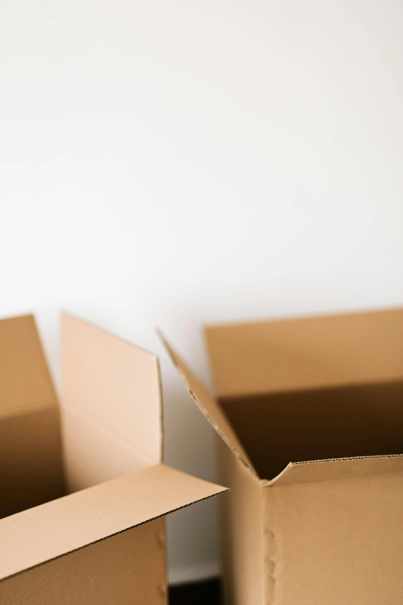 two open cardboard boxes sitting next to each other, by Carey Morris, trending on pexels, minimalism, square, slim, 4l, with a white background