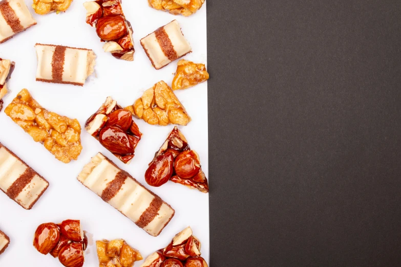 a close up of a plate of food on a table, an album cover, trending on pexels, visual art, mars candy bars, walnuts, background image, 15081959 21121991 01012000 4k