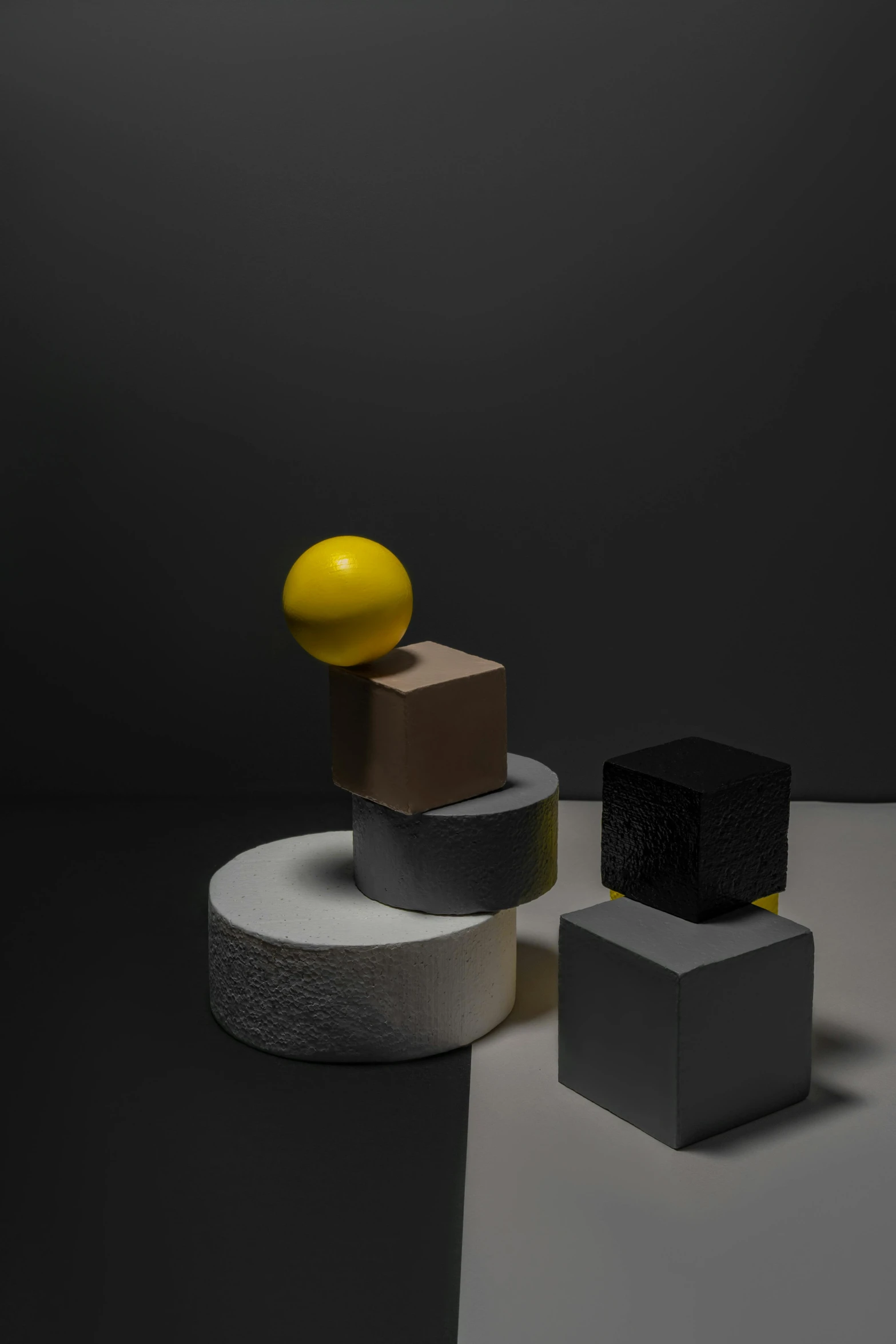 a group of cubes sitting on top of a table, an abstract sculpture, inspired by Bauhaus, trending on polycount, yellow charcoal, behance lemanoosh, sphere, single figure