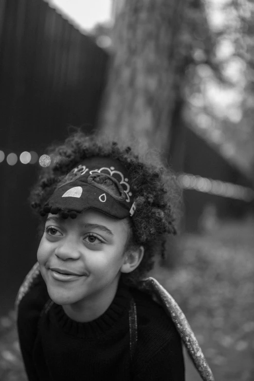 a black and white photo of a young girl, pexels contest winner, trippie redd, little elf tomboy, early evening, small hat