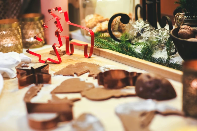 a table that has a bunch of cookies on it, by Julia Pishtar, pexels contest winner, folk art, santa's workshop, intricate copper details, reindeer made out of shadows, profile image