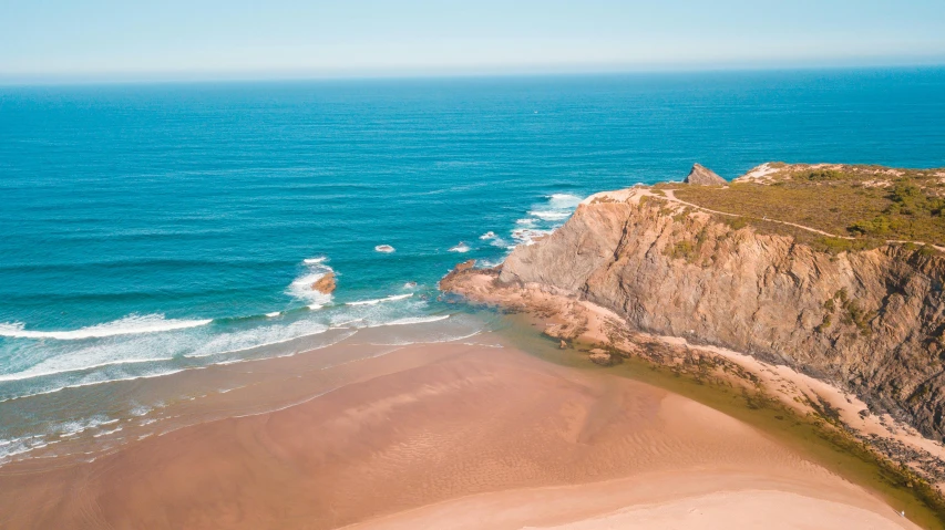 a large body of water next to a sandy beach, pexels contest winner, bispo do rosario, 2 5 6 x 2 5 6 pixels, high - angle view, pch