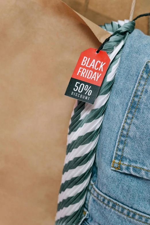 a black friday sale tag hangs on a pair of jeans, a cartoon, trending on unsplash, colorized photo, thumbnail, wearing stripe shirt, ribbon