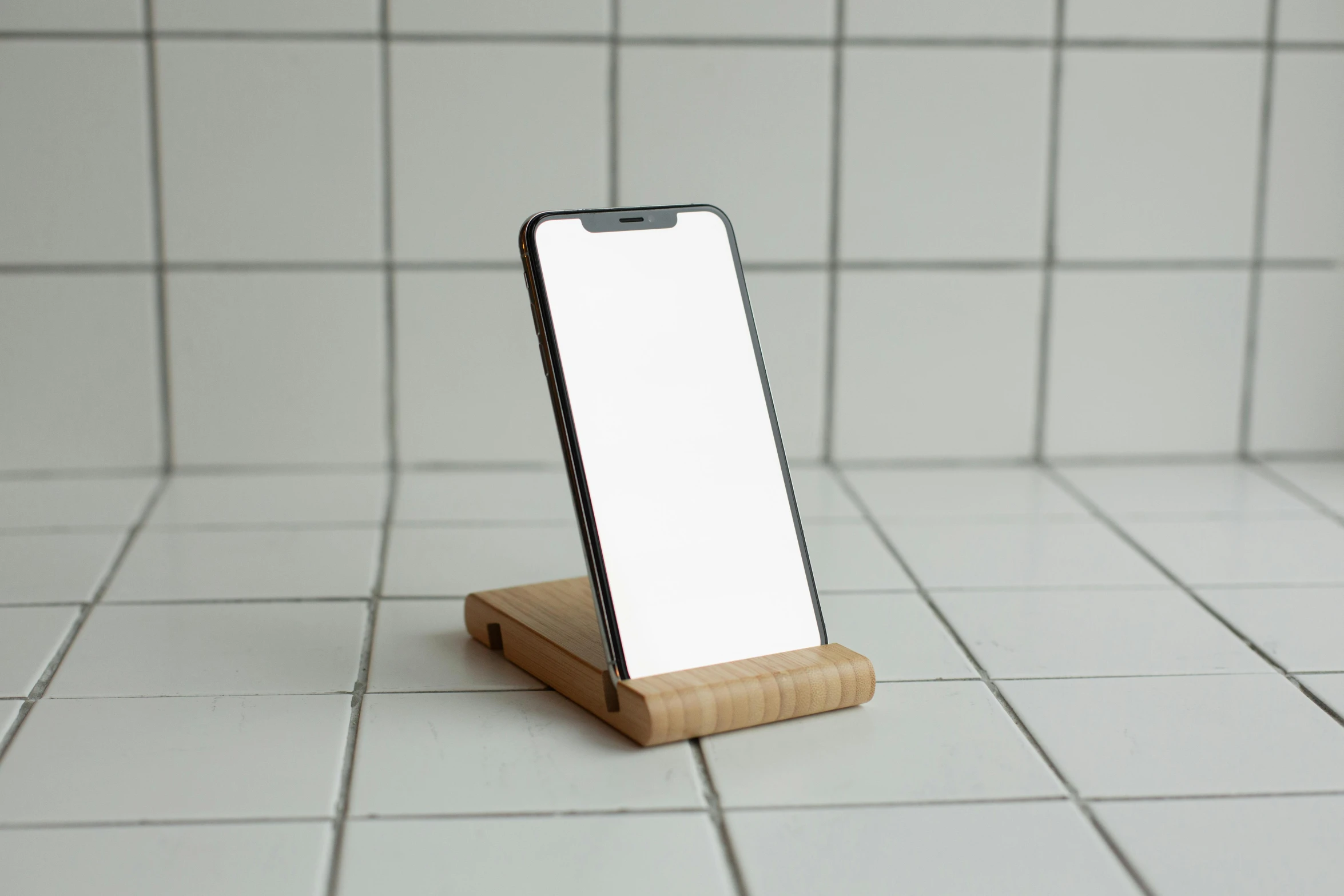 a cell phone sitting on top of a wooden stand, by Android Jones, unsplash, bauhaus, square, polished maple, full body-n 9, medium frame