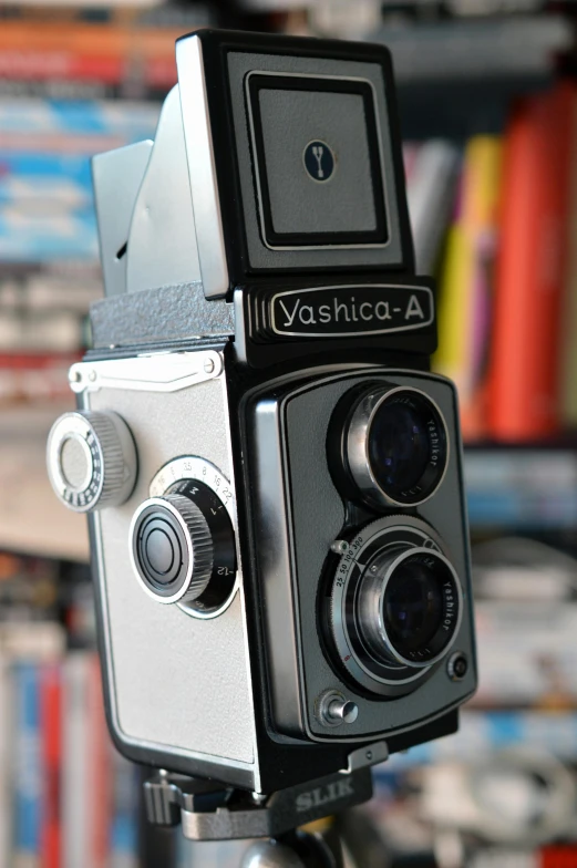 a close up of a camera on a tripod, yashica me - 1, rolleiflex tlr, vhs colour photography, ansel ]