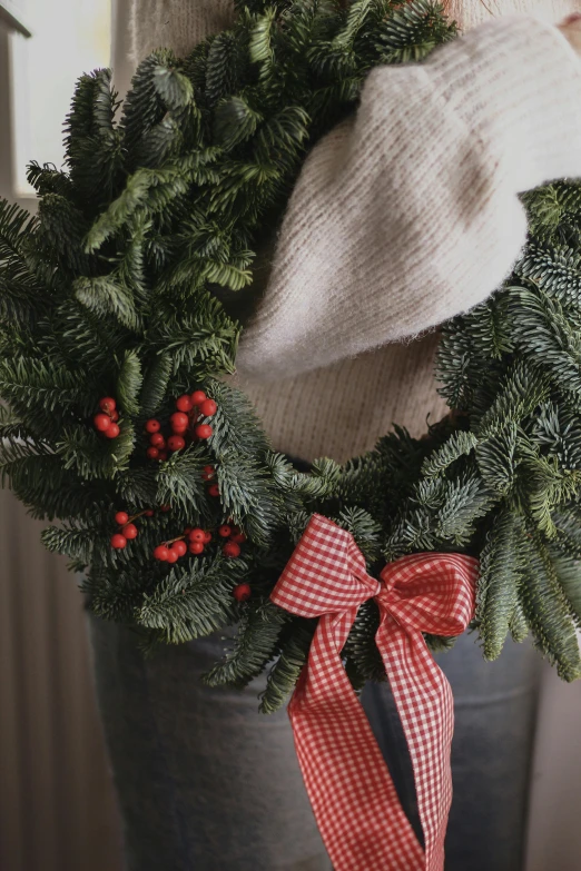 a close up of a wreath on a door, cozy setting, no cropping, f / 2 0, evergreen