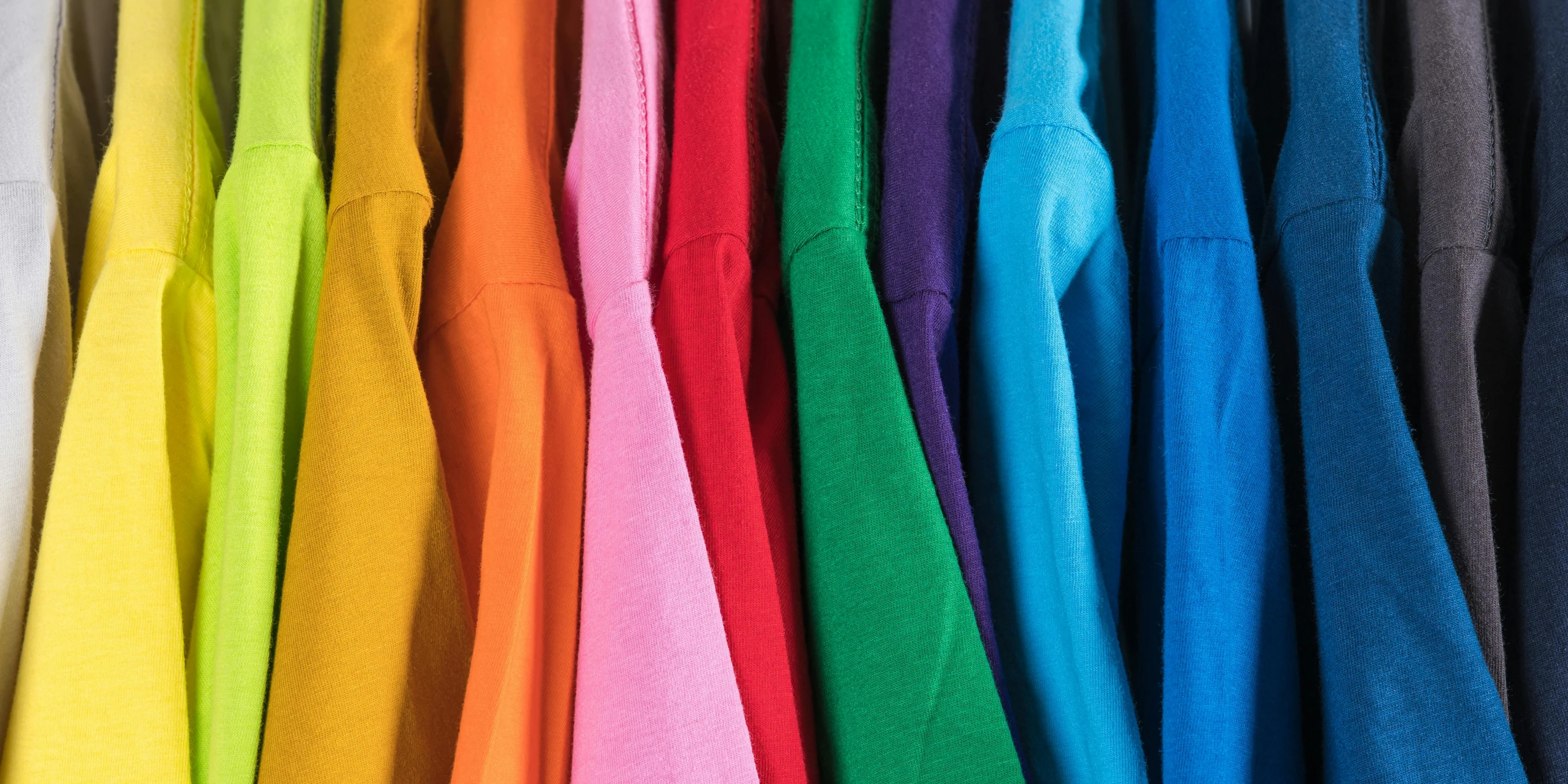 a bunch of different colored shirts hanging on a rack, pexels, color field, polychromatic spectrum, no - text no - logo, up-close, long sleeves