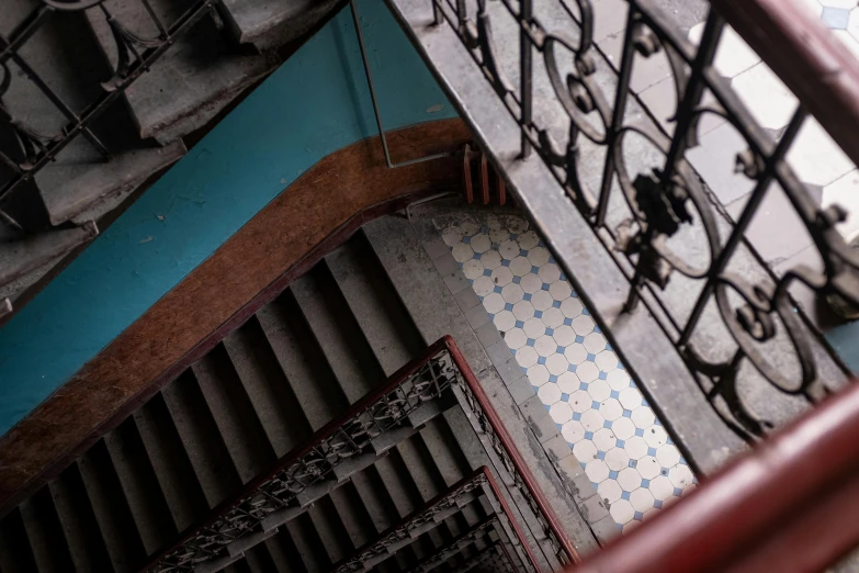 a view from the top of a set of stairs, unsplash contest winner, art nouveau, maroon and blue accents, mexico city, alessio albi, square