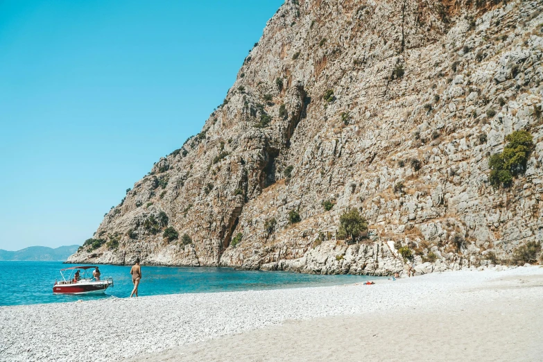 a couple of boats sitting on top of a sandy beach, pexels contest winner, les nabis, hydra, 🎀 🍓 🧚, sheer cliffs surround the scene, thumbnail