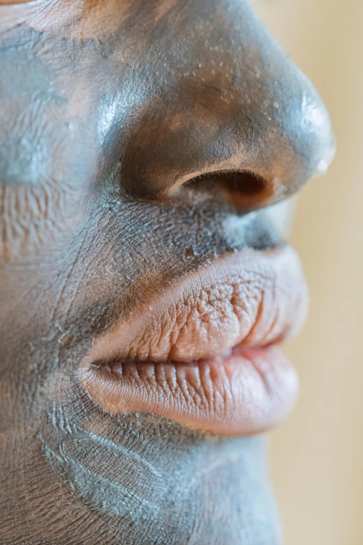 a close up of a person with mud on their face, an album cover, by Doug Ohlson, hyperrealism, puffy lips, man is with black skin, silicone skin, skin texture details