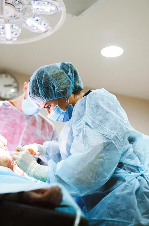 a group of surgeons performing surgery on a patient, by Meredith Dillman, shutterstock, multiple stories, mid shot photo, thumbnail, banner