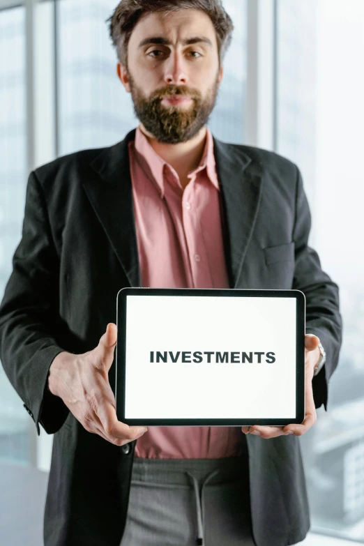 a man holding a tablet with investments written on it, by Dan Content, pexels, incoherents, rectangle, no - text no - logo, large)}], pic