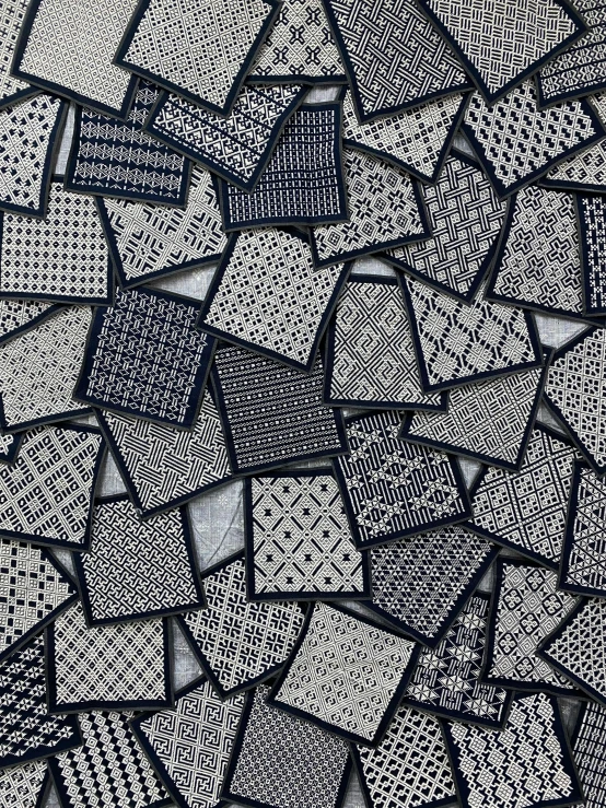 a black and white photo of a bunch of squares, a mosaic, by Hiromitsu Takahashi, mesh fabrics, cozy calm! fabrics textiles, shipibo patterns, many pieces