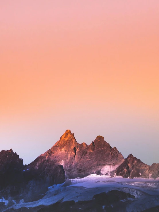 a couple of mountains that are next to each other, an album cover, unsplash contest winner, warm glow, chamonix, sherbert sky, pixel perfect photograph