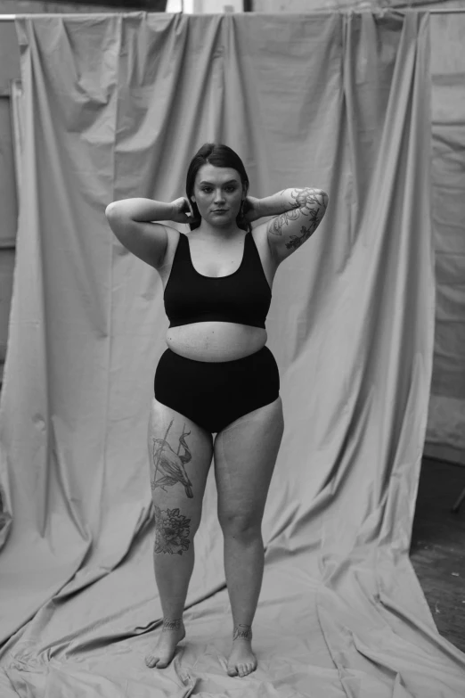 a black and white photo of a woman posing for a picture, a black and white photo, by Jessie Alexandra Dick, thicc, kailee mandel, bodies, concerned