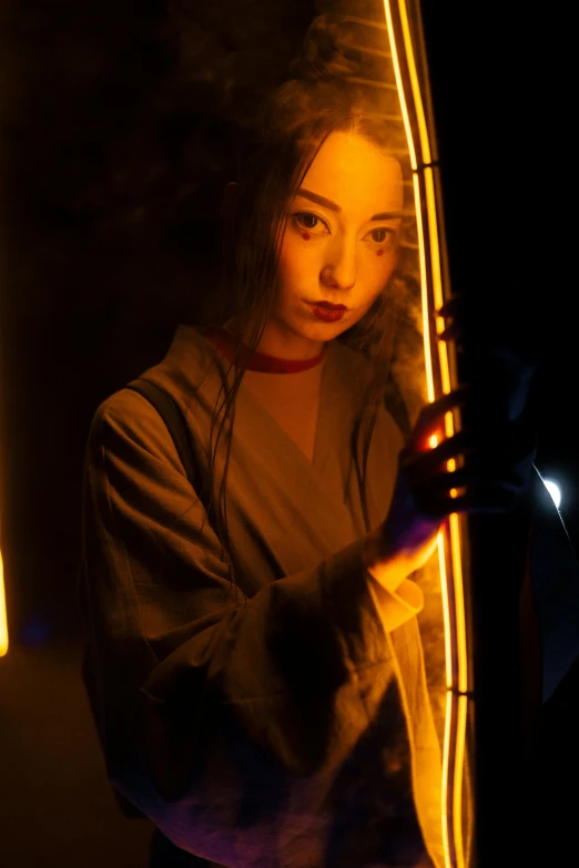 a woman holding a surfboard in the dark, an album cover, inspired by Kanō Sanraku, neo-figurative, holding a lightsaber, cosplay photo, emerging from her lamp, hikari