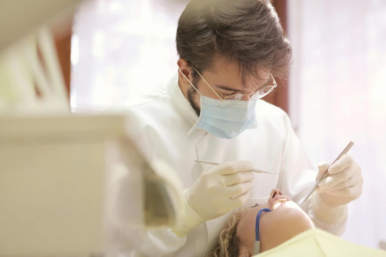 a woman getting her teeth examined by a dentist, pexels contest winner, hurufiyya, thumbnail, full daylight, romantic lead, lachlan bailey