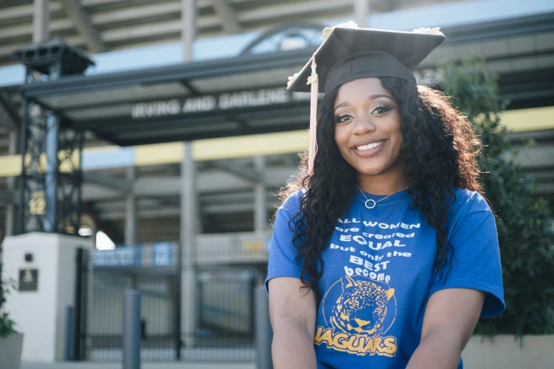 a woman wearing a graduation cap and gown, blue and white and gold, wakanda, thumbnail, recreation