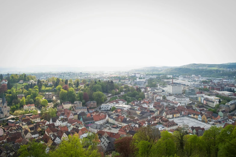 a view of a city from the top of a hill, by Thomas Häfner, portrait image, square, small town, high quality image