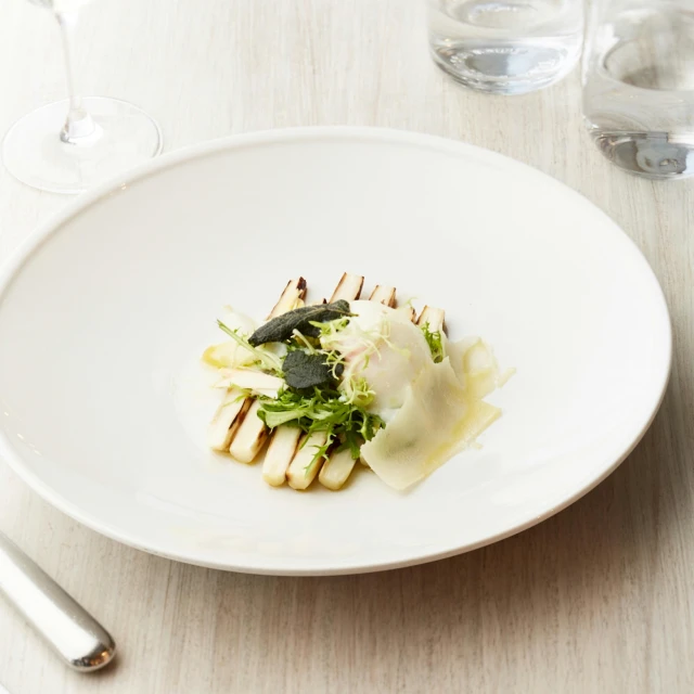 a close up of a plate of food on a table, inspired by Patrick Pietropoli, white steam on the side, square, mozzarella, with a soft