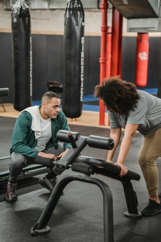 two people working out on a bench in a gym, riyahd cassiem, looking at the ground, asher duran, compassionate