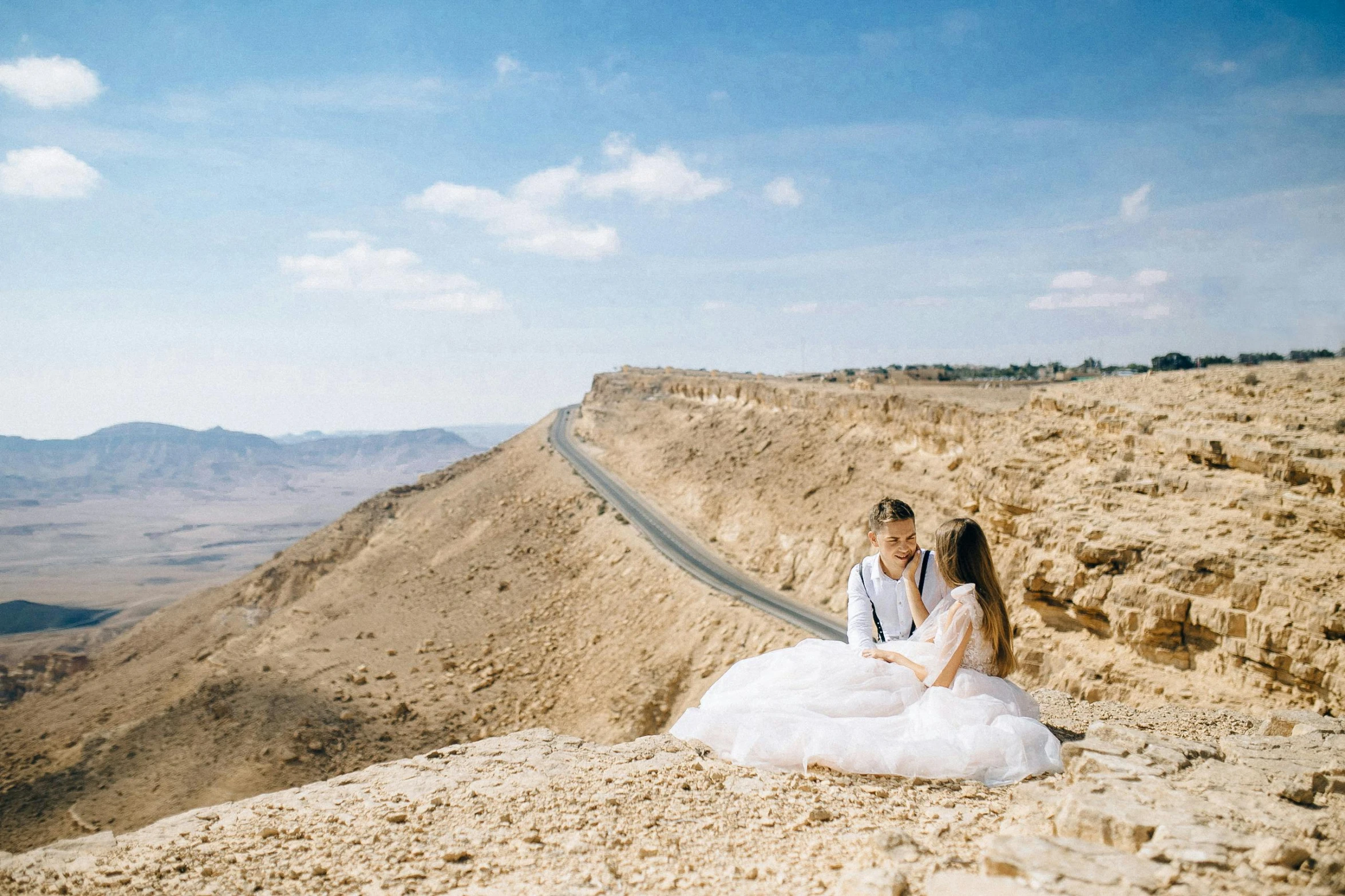 a couple of people sitting on top of a mountain, pexels contest winner, les nabis, wedding, israel, sunny day time, youtube thumbnail