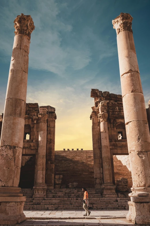 a man walking through the ruins of a building, pexels contest winner, neoclassicism, at pamukkale, archs and columns, square, cityscape ruins in the distance