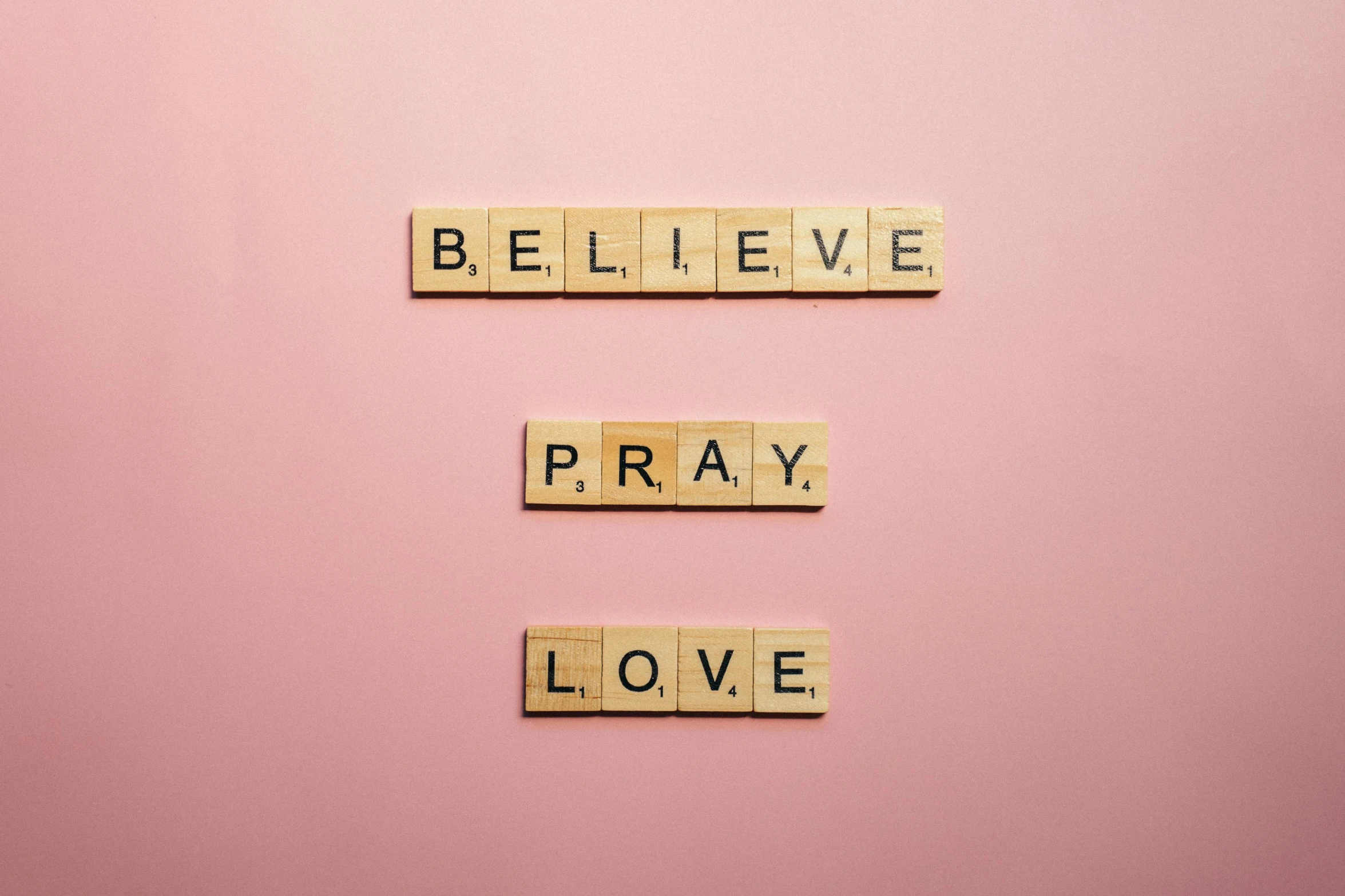 scrabbles spelling believe, pray, love on a pink background, by Sophia Beale, pexels, 1 6 x 1 6, a wooden, messages, wallpaperflare