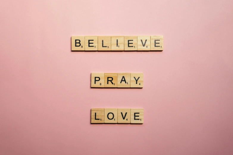scrabbles spelling believe, pray, love on a pink background, by Sophia Beale, pexels, 1 6 x 1 6, a wooden, messages, wallpaperflare