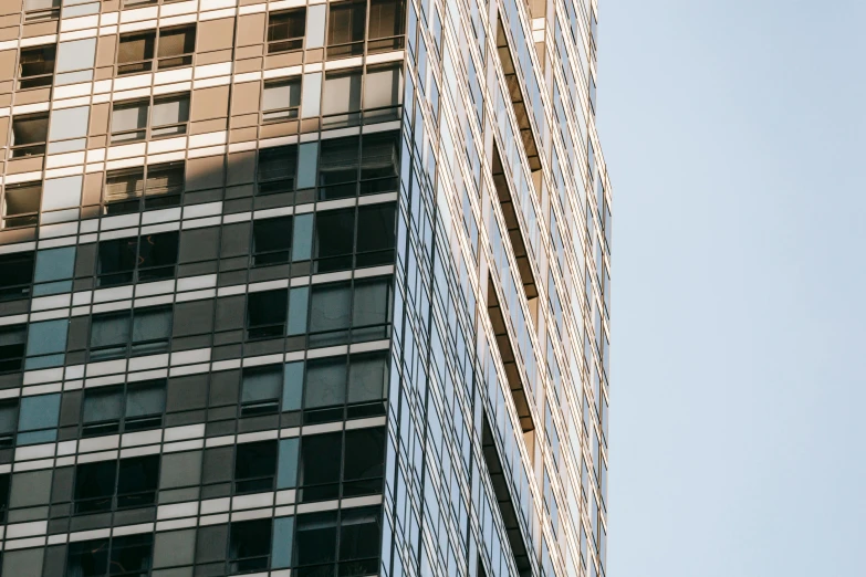 a clock mounted to the side of a tall building, by Adam Rex, pexels contest winner, modernism, steel window mullions, seen from a distance, thumbnail, ultra-high details