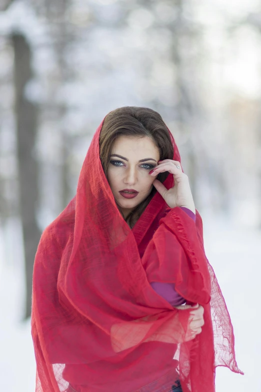 a woman wearing a red scarf in the snow, inspired by Andrei Rublev, renaissance, red fabric, red, muslim, brunette woman