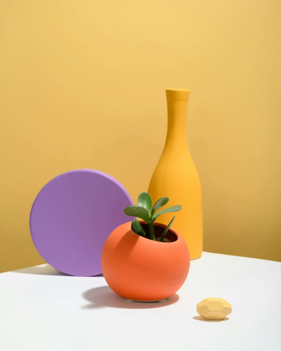 a couple of vases sitting on top of a table, orange planet, purple and yellow, full product shot, mini planets