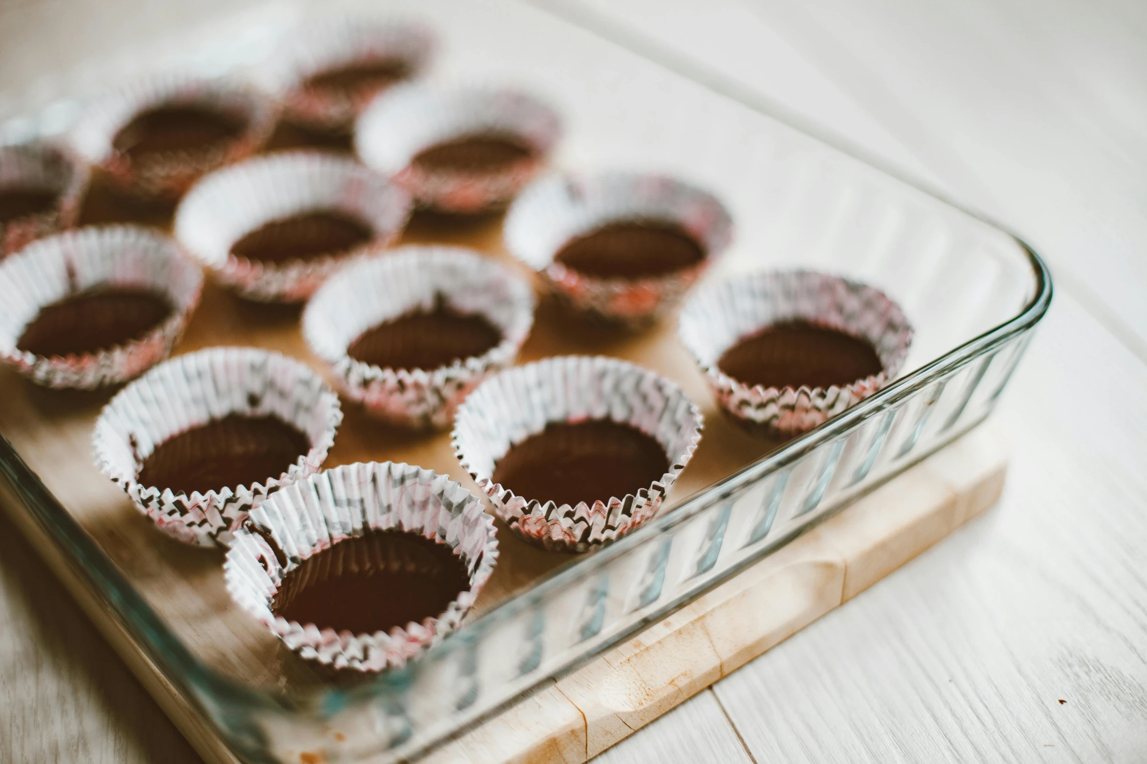 a glass baking dish filled with chocolate cupcakes, pexels, cardboard, gif, 5 5 mm photo, fan favorite