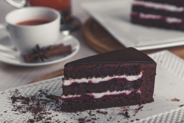 a piece of chocolate cake sitting on top of a white plate, by Emma Andijewska, unsplash, figuration libre, pink, tea party, highly detailed image, extra high resolution