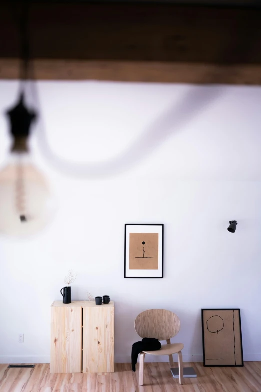 a living room filled with furniture and a lamp, poster art, unsplash, minimalism, with a wooden stuff, things hanging from ceiling, close up portrait shot, dwell