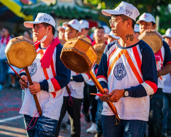 a group of men standing next to each other holding drums, pexels contest winner, happening, taiwan, avatar image, parade, ruan jia and fenghua zhong